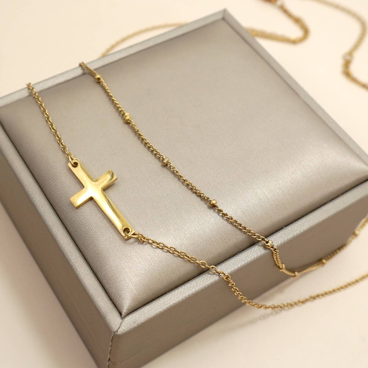 LAYERED CROSS NECKLACE